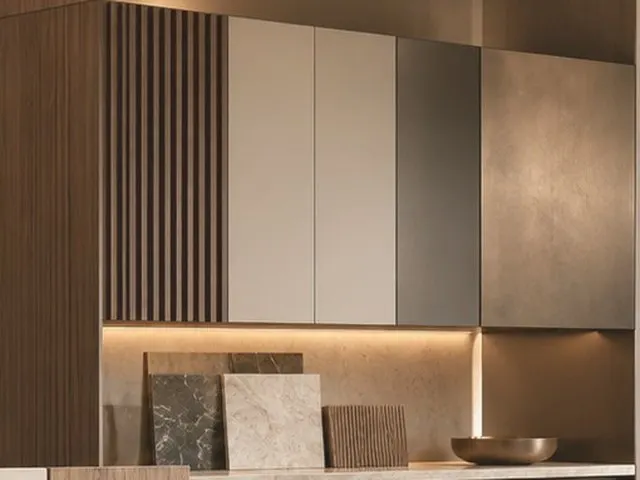 Fluted timber joinery with flat-panel cabinet doors and under-cabinet lighting